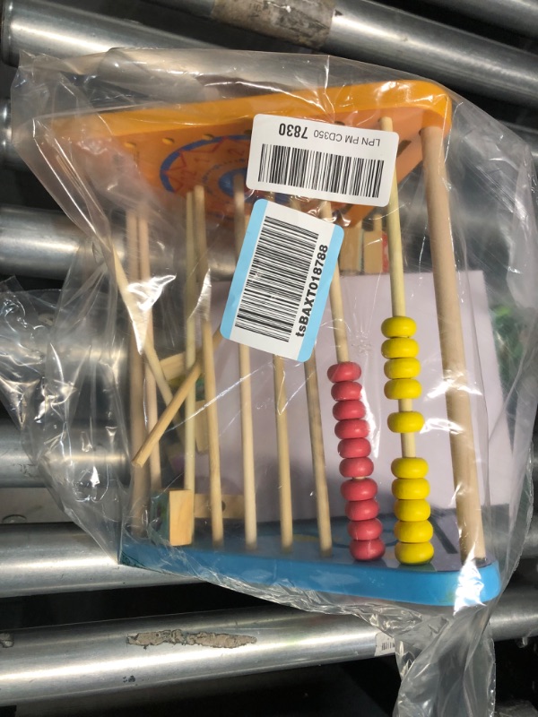 Photo 1 of **DAMAGE**  TOWO Wooden Activity Centre Triangle Toys - flip Flop Alphabet Blocks Abacus Clock - Activity Cube - loose pieces, may be fixable