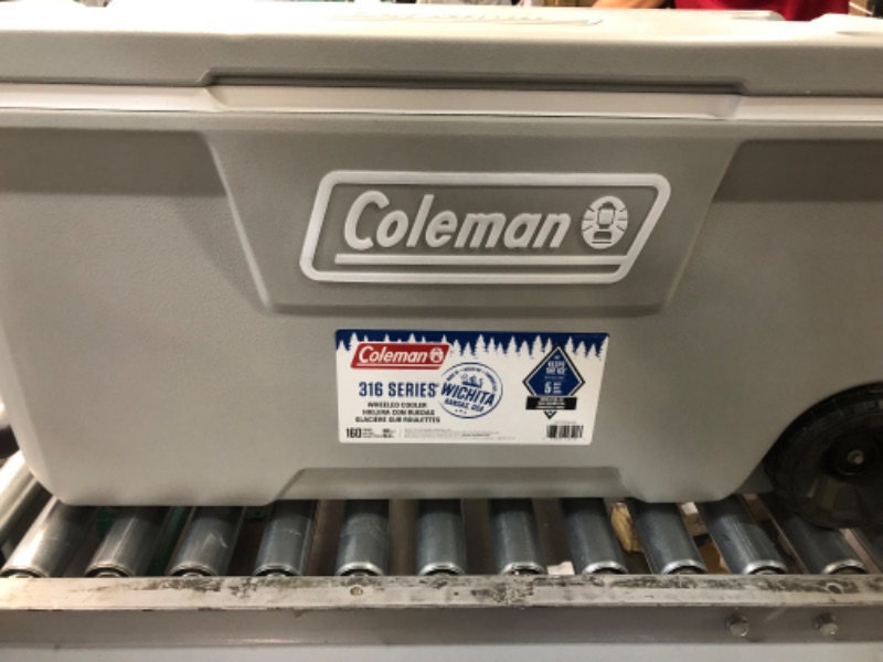 Photo 3 of **MINOR SLASH ON THE TOP FROM BLADE STILL FUNCTIONAL NOT CUT DEEP AND LOOKS BRAND NEW** Coleman 316 100qt Wheeled Cooler - Rock Gray