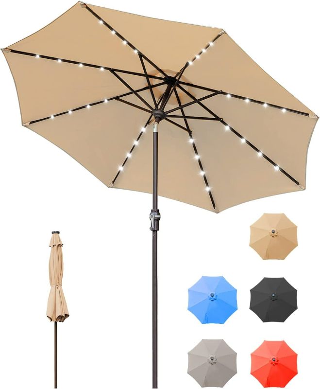 Photo 1 of 9FT Patio Umbrella, Solar Powered LED Umbrellas with 32 LED Lights 8 Ribs/Tilt Adjustment and Crank Lift System for Garden, Backyard and Pool - Tan