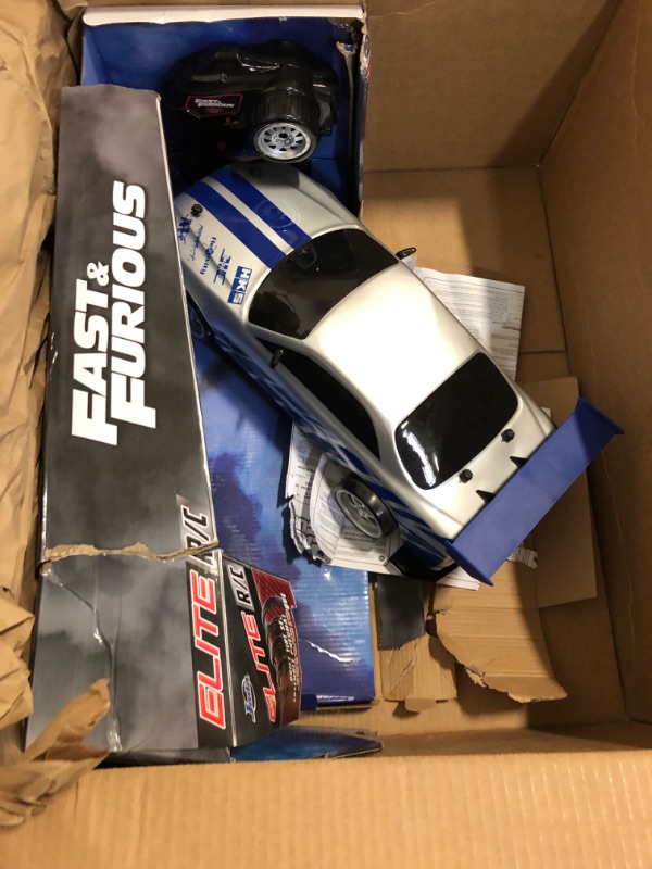 Photo 2 of Jada Toys Fast & Furious Brian's Nissan Skyline GT-R (BN34) Drift Power Slide RC Radio Remote Control Toy Race Car with Extra Tires, 1:10 Scale, Silver/Blue
