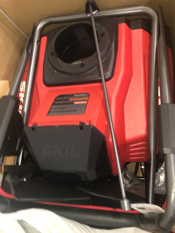 Photo 2 of SKIL PWR CORE 40 Brushless 40V 20 in. Single Stage Snow Blower Kit, 30'ft Throwing Distance, Includes 6.0Ah Battery and Charger- SB2001C-10 red 20 In. Snow Blower Kit