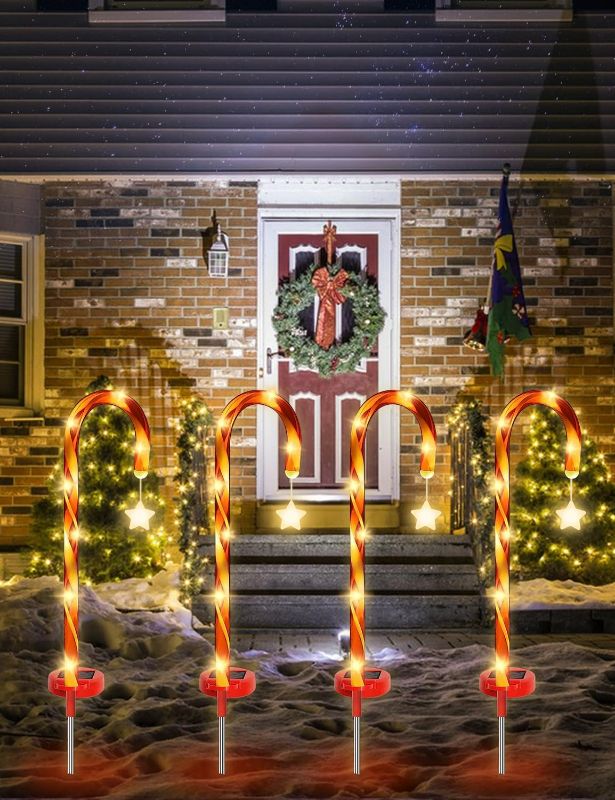 Photo 1 of Outdoor Christmas Decorations, Solar Christmas Candy Cane Pathway Marker Lights Xmas Decors for Outdoor Yard Garden Driveway Lawn Xmas Tree (4 Pack)
