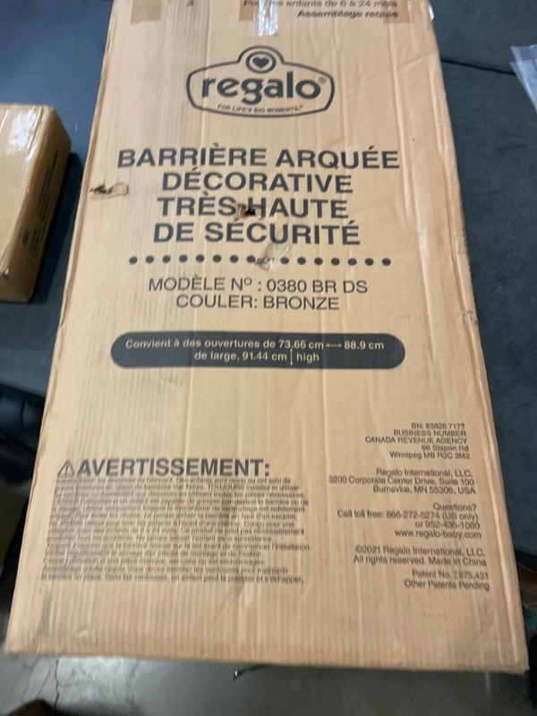 Photo 2 of Regalo Easy Step Extra Tall Arched Décor Walk Thru Baby Gate, Includes 4-Inch Extension Kit, 4 Pack Pressure Mount Kit and 4 Pack Wall Mount Kit, Bronze 36-Inches Tall