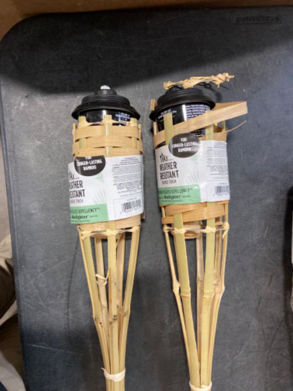 Photo 2 of TIKI Brand 4-Pack Luau Bamboo Torches, Weather Resistant Coated Torch, Outdoor Décor for Home, Garden, Patio, 57 Inch, Natural, 1117078,Beige