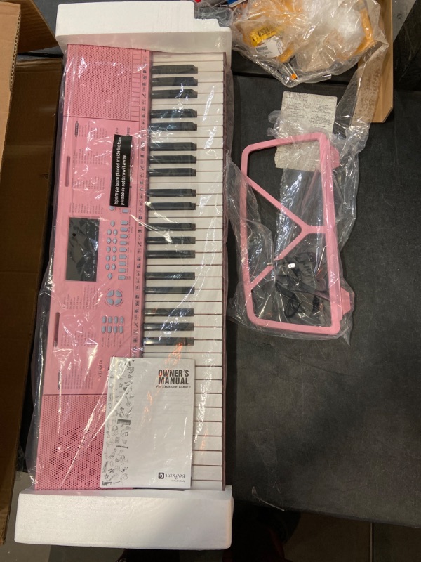 Photo 2 of Vangoa VGK610 Piano Keyboard, 61 Mini Keys Portable Music Keyboard for Beginners with Microphone, 3 Teaching Modes, 350 Tones, 350 Rhythms, 30 Demos, Pink