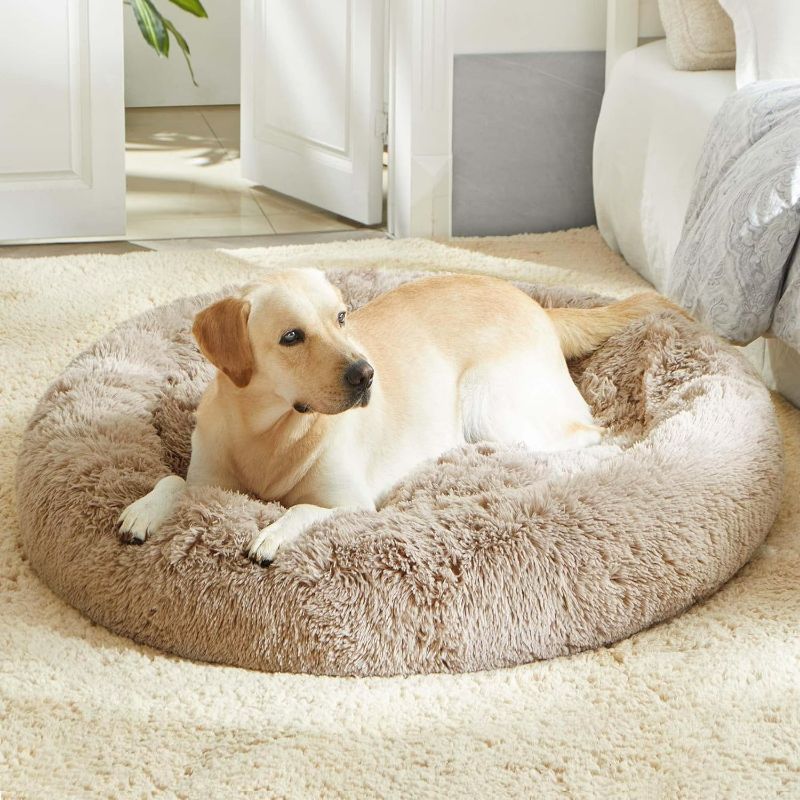 Photo 1 of Calming Dog Bed & Cat Bed, Anti-Anxiety Donut Dog Cuddler Bed, Warming Cozy Soft Dog Round Bed, Fluffy Faux Fur Plush Dog Cat Cushion Bed for Small Medium Dogs and Cats (20"/24"/27"/30")
