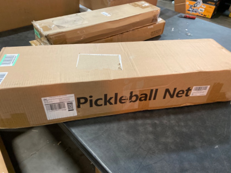 Photo 1 of Portable Pickleball Net on Wheels, 22FT Standard Pickleball Net for Driveway Backyard, Strong PE Net, Metal Frame, 4 Balls, 1 Carry Bag, Pickleball Net System for Indoor & Outdoor Play
