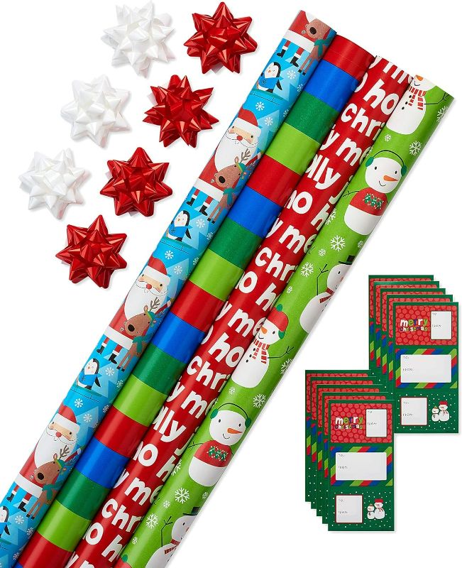 Photo 1 of American Greetings 120 sq. ft. Kids Christmas Wrapping Paper Set, Santa, Snowmen, Stripes and Christmas Text (4 Rolls 30 in. x 12 ft., 7 Bows, 30 Gift Tags)
