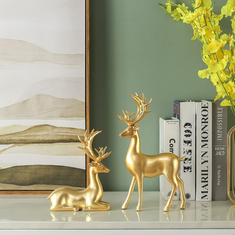 Photo 2 of FANTESTICRYAN 2pcs Reindeer Sculpture Gold Resin Christmas Elk Statues Home Office Decorative Displays for Living Room, Bedroom, Bathroom, Bookshelf, Desktop, Cabinets (Golden Large)
