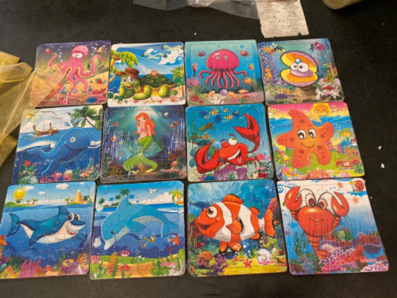 Photo 2 of Vileafy 12Pack Wooden Jigsaw Puzzles Party Favors for Kids Age 4-8 Years Old, Sea Animals Small Toddler Puzzles - Gifts and Travel Puzzles 20 Pieces Per Puzzle with Organza Bags
