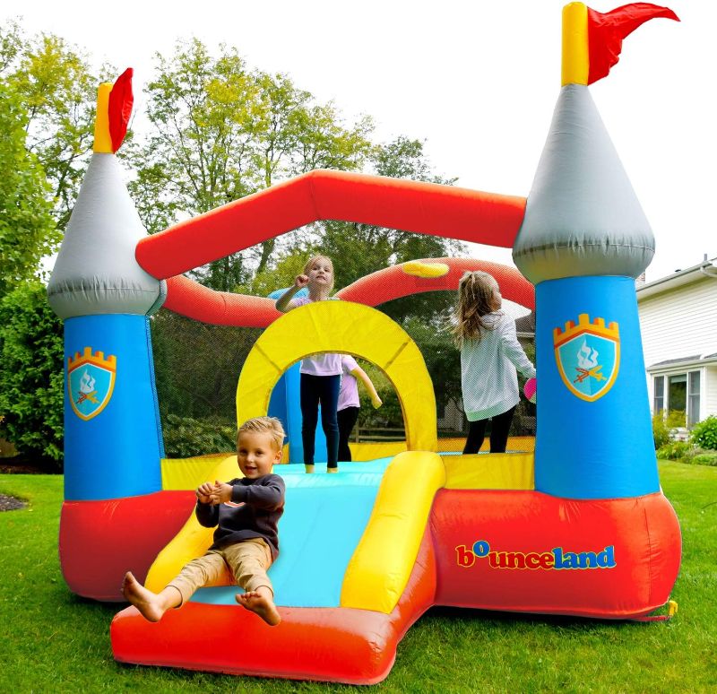 Photo 1 of Bounceland Bounce House Castle with Basketball Hoop Inflatable Bouncer, Fun Slide, Safe Entrance Opening, 12 ft x 9 ft x 7 ft H