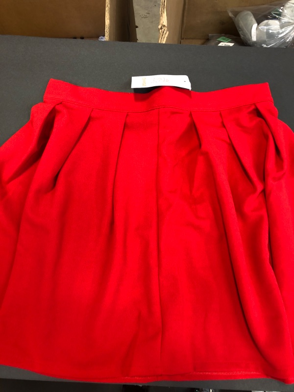 Photo 1 of WOMENS RED SKIRT SIZE LARGE, POSSIBLY FOR KIDS, SMALL ADULTS, LOOKS VERY SMALL FOR A LARGE.