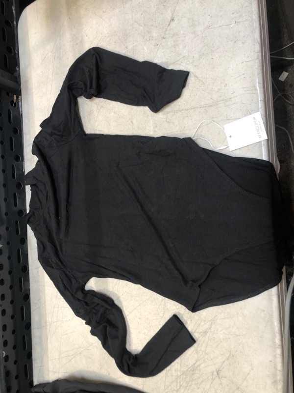 Photo 1 of BLACK BODY SUIT 
SIZE UNKNOWN 
SIZE APPEARS TO BE -XS /SMALL