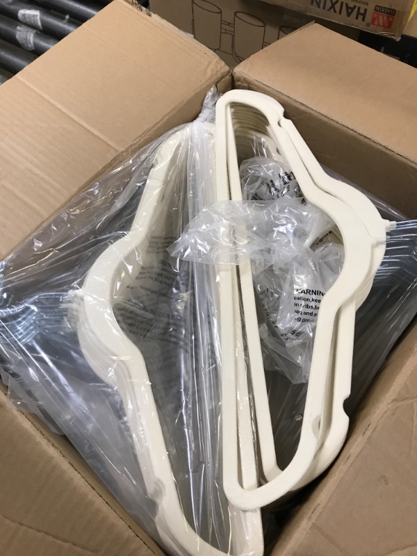 Photo 1 of 100 pack of hangers 