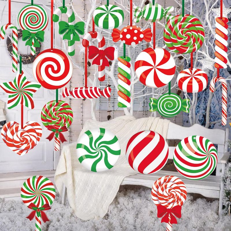 Photo 1 of 24 Pcs Christmas Candy Yard Ornaments Outdoor Candy Hanging Ornaments Christmas Candy Peppermint Yard Sign Double Sided Lollipop Lawn Decoration for Xmas Tree Winter Holiday Christmas Party Decor
