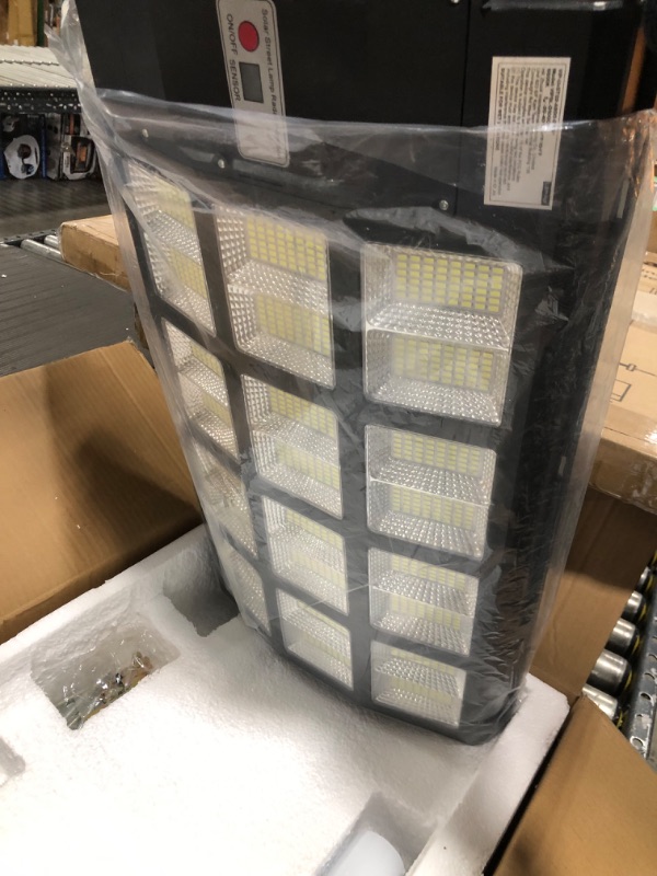 Photo 1 of lamvip 1200W Solar Street Lights Outdoor, Motion Sensor Dusk to Dawn Led Solar Light IP67 Waterproof 120000LM Flood Lights with Remote Control 1125 LED Beads for Parking Lot Yard Garden Patio Walkway 1200 Watts