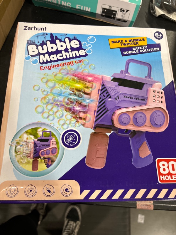 Photo 2 of Bubble Gun with Light Bubble Solution Automatic 69 Holes Bubble Machine Gun Bubbles Maker Blaster Blower Toys for Kids Outdoor Indoor Birthday Wedding Party Pink