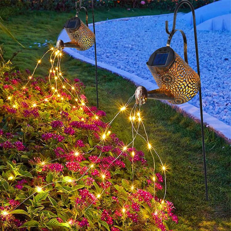 Photo 1 of  Glintoper 2 Pack Outdoor Solar Watering Can Garden Lights, Metal Waterfall Figurine Lights with Shepherd Hook, Decorative Yard Art for Mom, Mothers Day Ideal Gifts, for Patio Walkway Pathway Lawn 
