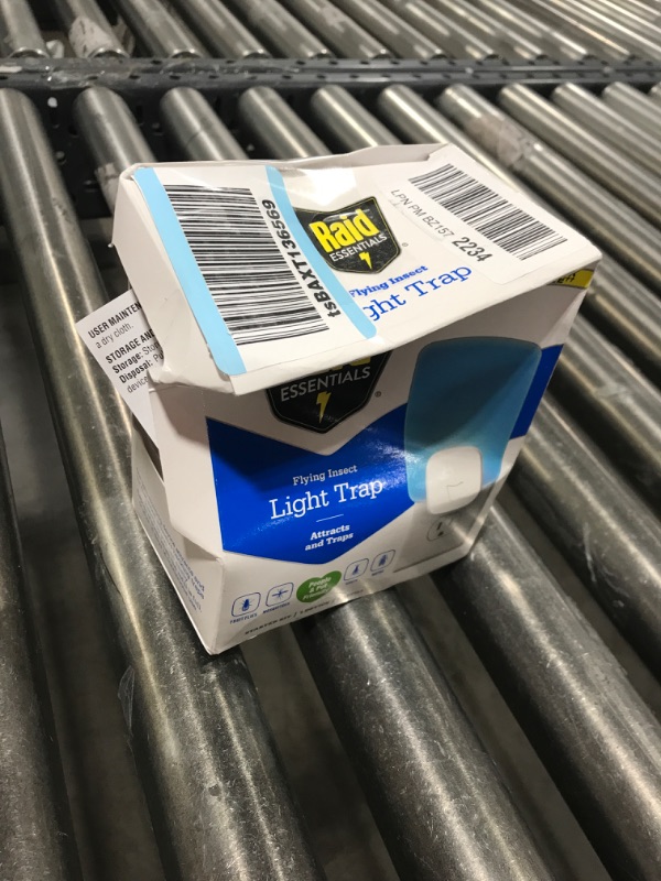 Photo 1 of Raid Essentials Flying Insect Light Trap Starter Kit, 1 Plug-in Device + 1 Cartridge, Featuring Light Powered Attraction Starter Kit (1 Device + 1 Cartridge)