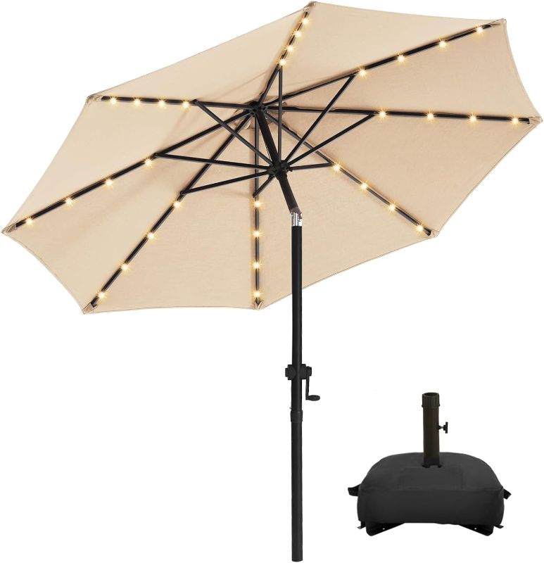 Photo 1 of wikiwiki 10FT Solar Led Patio Umbrella with Base, Sturdy Outdoor Market Umbrella for Deck, Pool, Garden w/Tilt, Crank, 32 LED Lights, Beige
