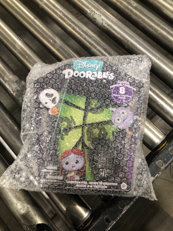 Photo 2 of  Disney Doorables Tim Burton’s The Nightmare Before Christmas Collection Peek, 8 Exclusive Mini Figures, Officially Licensed Kids Toys for Ages 5 Up 