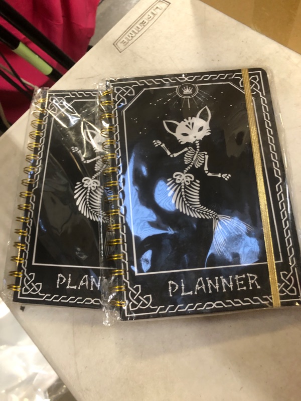 Photo 2 of  2 BOOKS 
2024 Planner, 12-Month Weekly Monthly Planner from JAN.2024 to DEC.2024, 8.4" X 6", Planner Notebook with Spiral Bound, Stickers & Sticky Index Tabs, Fox-Fish Skull Black - 01