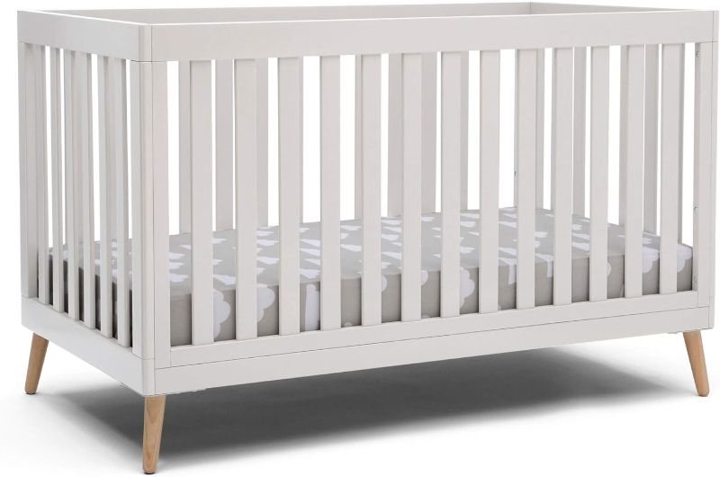 Photo 1 of Delta Children Essex 4-in-1 Convertible Baby Crib, Bianca White with Natural Legs