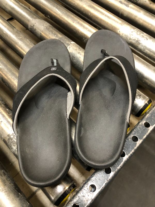 Photo 1 of black flip flops size 12