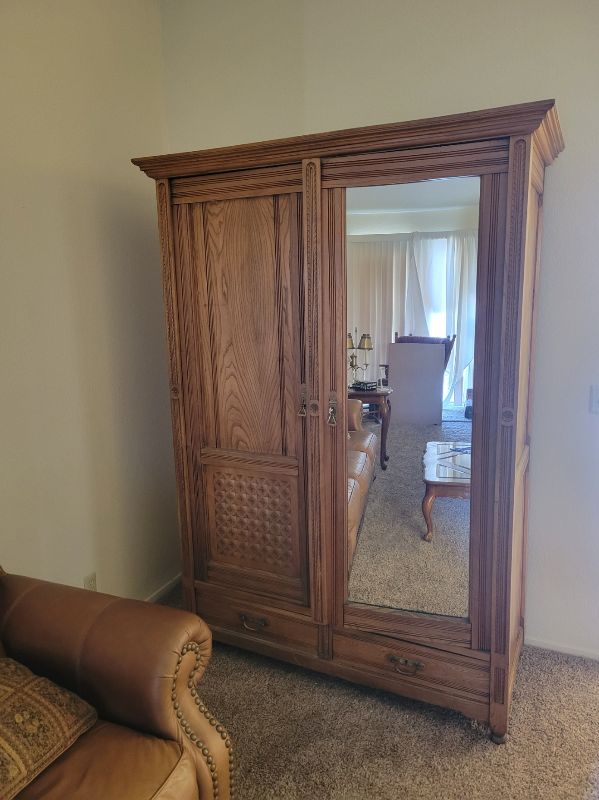 Photo 1 of OAK ENTERTAINMENT CENTER W MIRRORED DOOR 57” X 26” H 80”