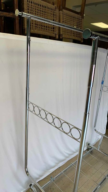 Photo 1 of CLOTHING RACK WITH WHEELS