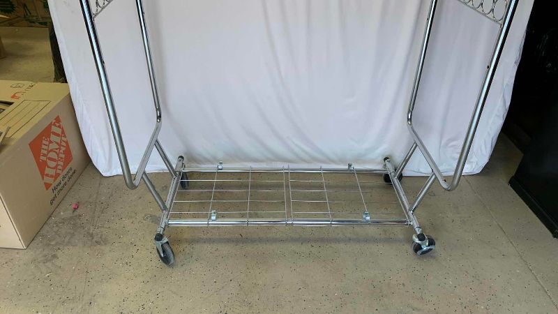 Photo 1 of CLOTHING RACK WITH WHEELS