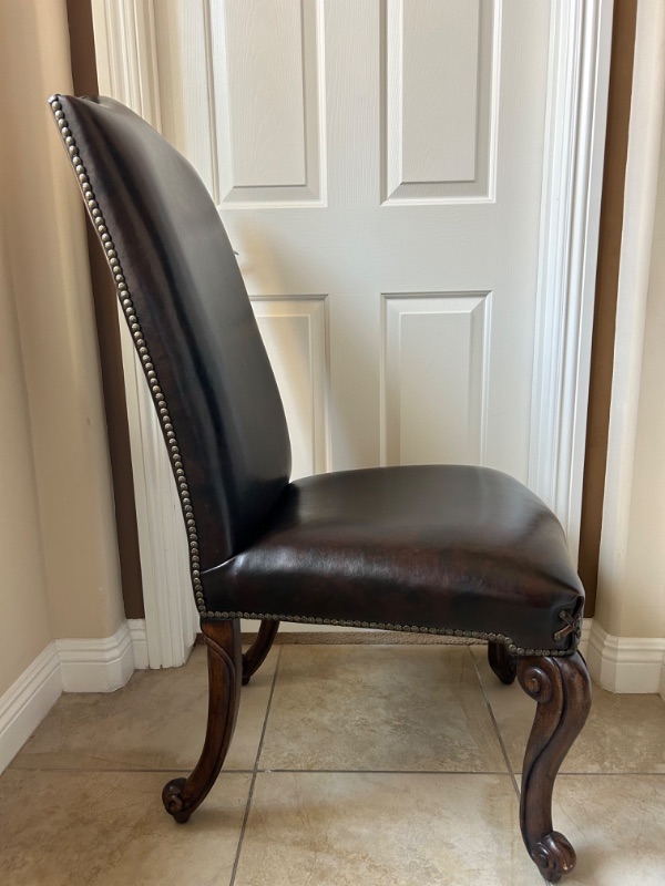 Photo 9 of LEATHER DINING SIDE CHAIR WITH CROSS DETAIL AND STUDS EMBELISHMENT 23” x 24” x 45