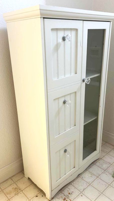 Photo 1 of SMALL WHITE CABINET 19” x 9 1/2” x H34 1/2”