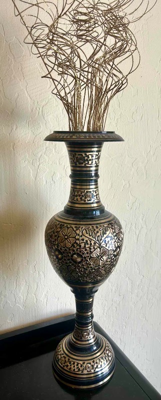 Photo 1 of BLACK AND GOLD METAL VASE, H 20.5”, WITH GOLD REEDS.