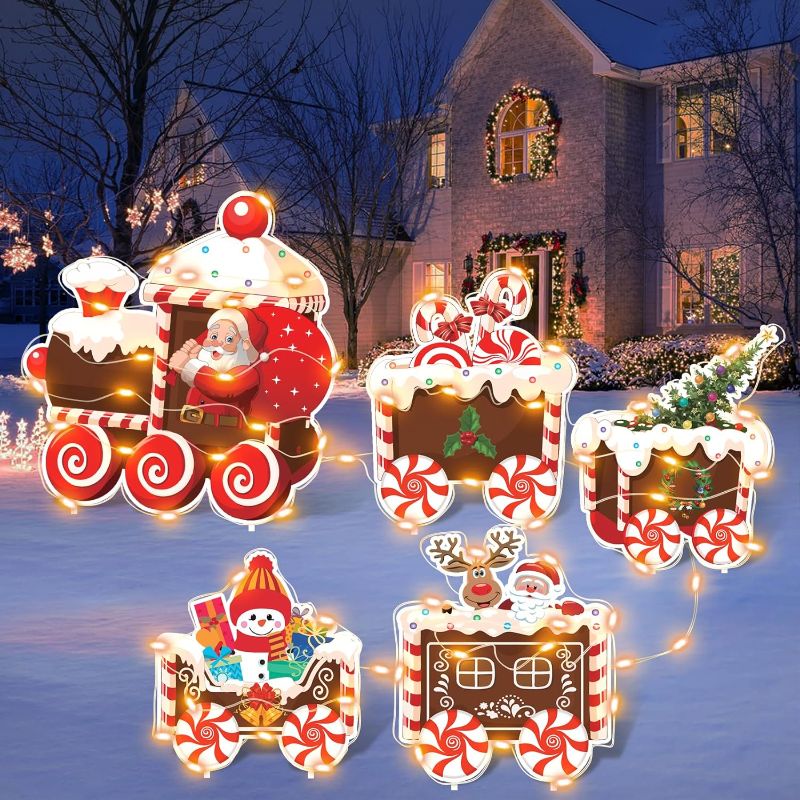 Photo 1 of **See notes**Korlon Tec Christmas Yard Signs with LED Lights, 5Pcs Christmas Decorations Outdoor Snowman Santa Train Set Lawn Christmas Yard Stakes for Xmas Holiday Garden Decor