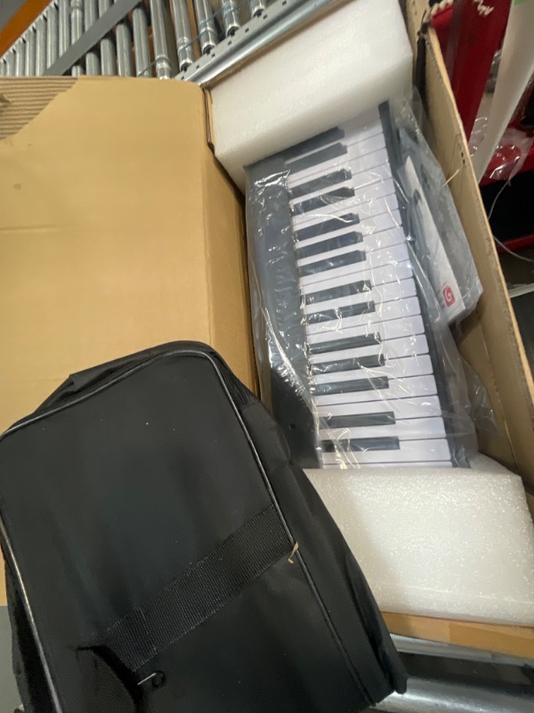 Photo 2 of ***see notes***Vangoa Folding Piano Keyboard 88 Key Full Size Semi-Weighted Bluetooth Portable Foldable Electric Keyboard Piano with Light up Keys, Sheet Music Stand, Sustain Pedal and Handbag, Black 88 Lighted Full Size Keys-Foldable Black