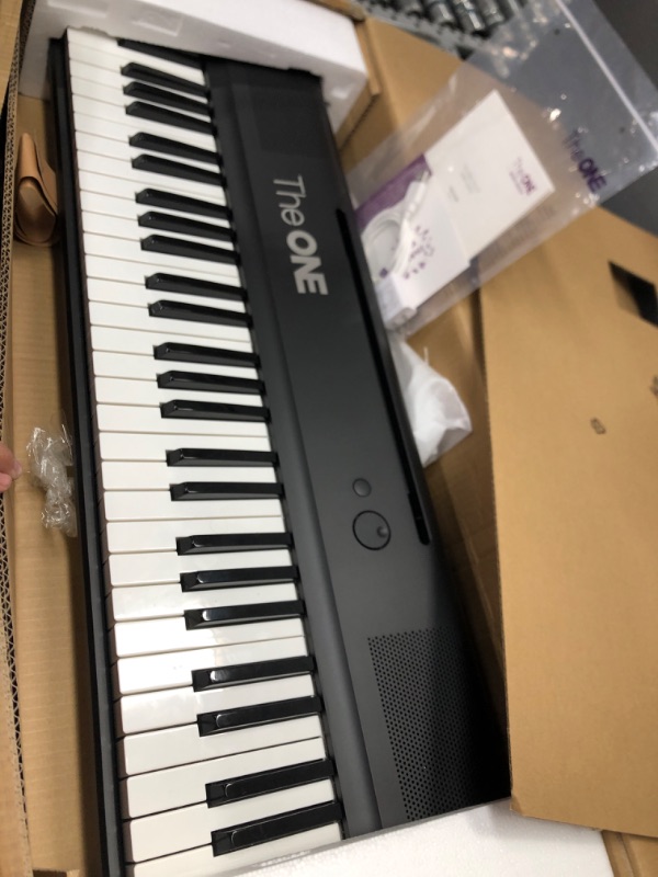 Photo 1 of The ONE Smart Keyboard COLOR 61 Lighted Keys Piano Keyboard, Electric Piano for Beginners with 256 Tones, 64 Polyphony, Built-in LED Lights and Free Apps (Black) Balck