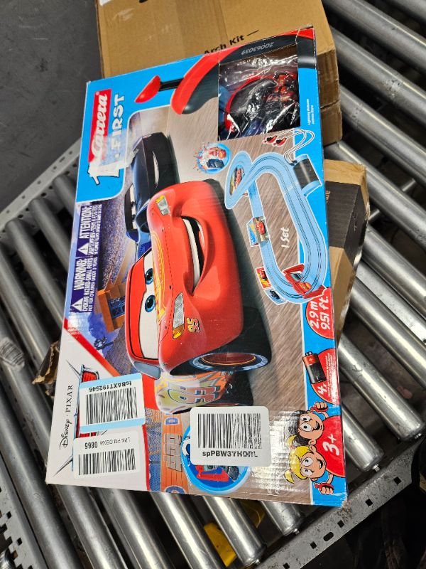 Photo 2 of Carrera First Disney/Pixar Cars - Slot Car Race Track - Includes 2 Cars: Lightning McQueen and Jackson Storm - Battery-Powered Beginner Racing Set for Kids Ages 3 Years and Up Disney Pixar Cars - Piston Cup