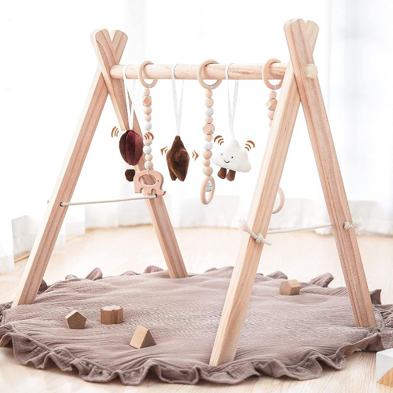 Photo 1 of ***SEE NOTES***
Wooden Baby Play Gym Play Mat, Baby Gym with 6 Hanging Sensory Toys Foldable Baby Gym