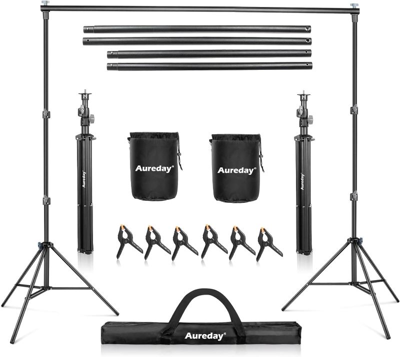 Photo 1 of Aureday Backdrop Stand, 10x7Ft Adjustable Photo Backdrop Stand Kit with 4 Crossbars, 6 Background Clamps, 2 Sandbags, and Carrying Bag for...
