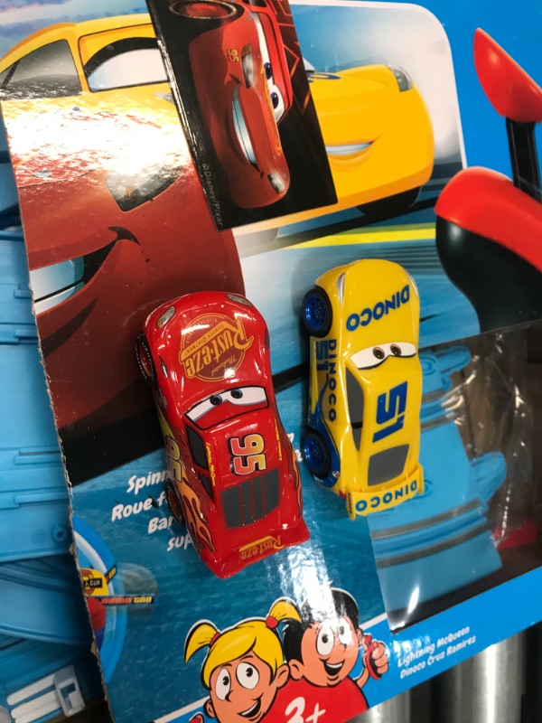 Photo 3 of Carrera First Disney/Pixar Cars - Slot Car Race Track - Includes 2 Cars: Lightning McQueen and Dinoco Cruz - Battery-Powered Beginner Racing Set for Kids Ages 3 Years and Up Disney Cars w/ Spinners