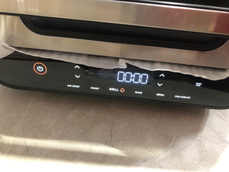 Photo 1 of ***USED - POWERS ON - UNABLE TO TEST FURTHER - LIKELY MISSING PARTS***
Ninja FG551 Foodi Smart XL 6-in-1 Indoor Grill with Air Fry, Roast, Bake, Broil & Dehydrate, Smart Thermometer, Black/Silver