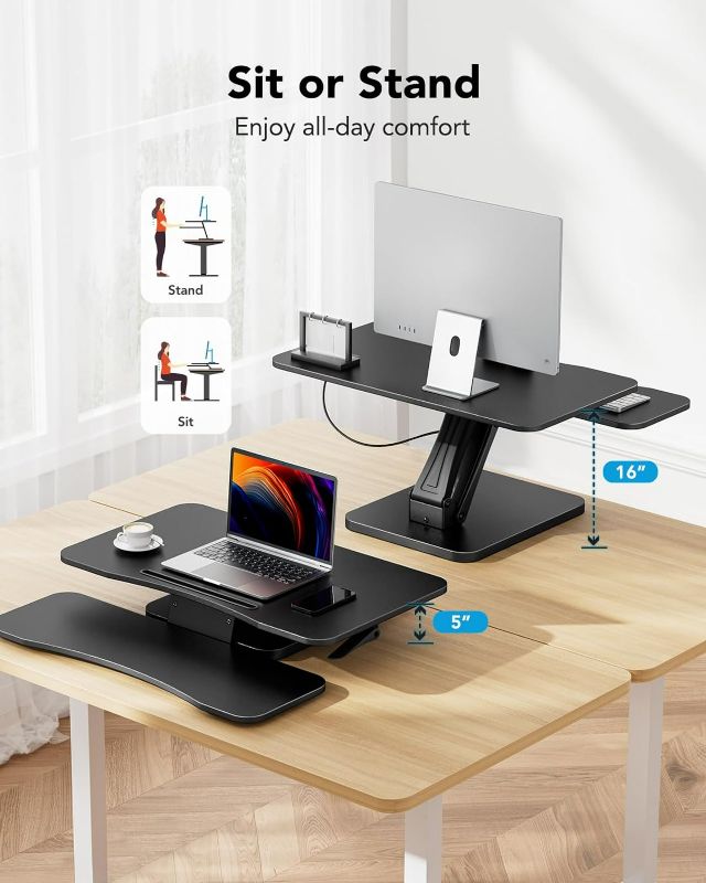 Photo 3 of (NON-REFUNDABLE) HUANUO Standing Desk Converter, 32 inch Sit to Stand Riser, Height Adjustable Standing Desk Riser with Wide Keyboard Tray for Monitor, Laptop, Computer Workstation with Slot & Anti-Slip Pads, Black