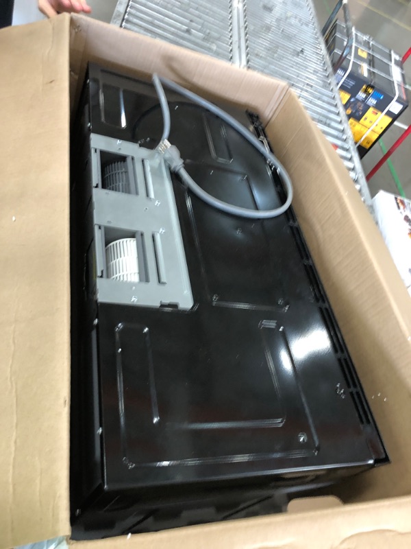 Photo 2 of 1.7 cu. ft. 1000-Watt Over the Range Microwave in Black