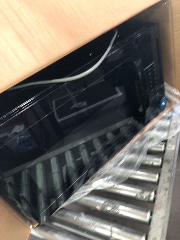 Photo 1 of 1.7 cu. ft. 1000-Watt Over the Range Microwave in Black