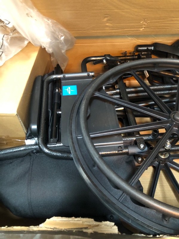 Photo 3 of Medline K1 Basic Vinyl Wheelchair with Full-Length Arms and Elevating Leg Rests, 18-Inch Wide Seat,Black