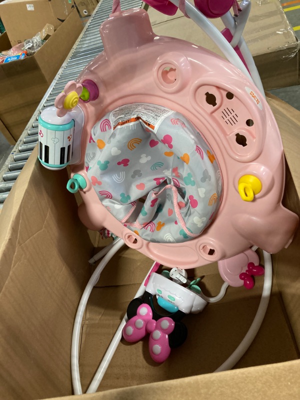 Photo 1 of Bright starts Disney Baby Minnie Mouse Forever Besties Baby Activity Center Jumper with 10 Toys, Lights & Sounds, 360-Degree Seat, 6-12 Months (Pink)