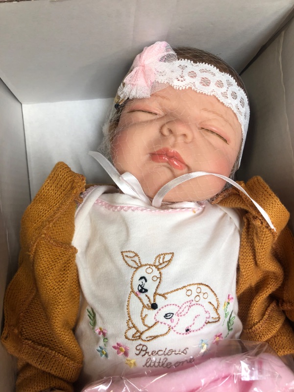 Photo 2 of Aori Lifelike Reborn Baby Dolls 22 Inch Baby Soft Body Realistic Newborn Baby Dolls Real Life Sleeping Baby Girl with Deer Toy Accessories for Kids Age 3 + Sleeping Deer