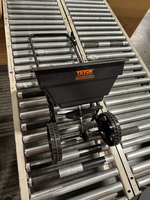 Photo 2 of VEVOR Broadcast Spreader, 100 LB Walk-Behind Turf Spreader with 12" Wheels, Steel Push Fertilizer Spreader, Garden Seeder, and Salt Spreader, Designed for Residential, Farm, and Tough Terrain, Black 100LB