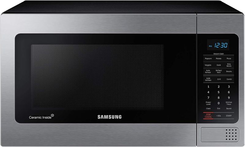 Photo 1 of **Dented on top** SAMSUNG 1.1 Cu Ft Countertop Microwave Oven w/ Grilling Element, Ceramic Enamel Interior, Auto Cook Options,1000 Watt, MG11H2020CT/AA, Stainless Steel, Black w/ Mirror Finish,15.8"D x 20.4"W x 11.7"H